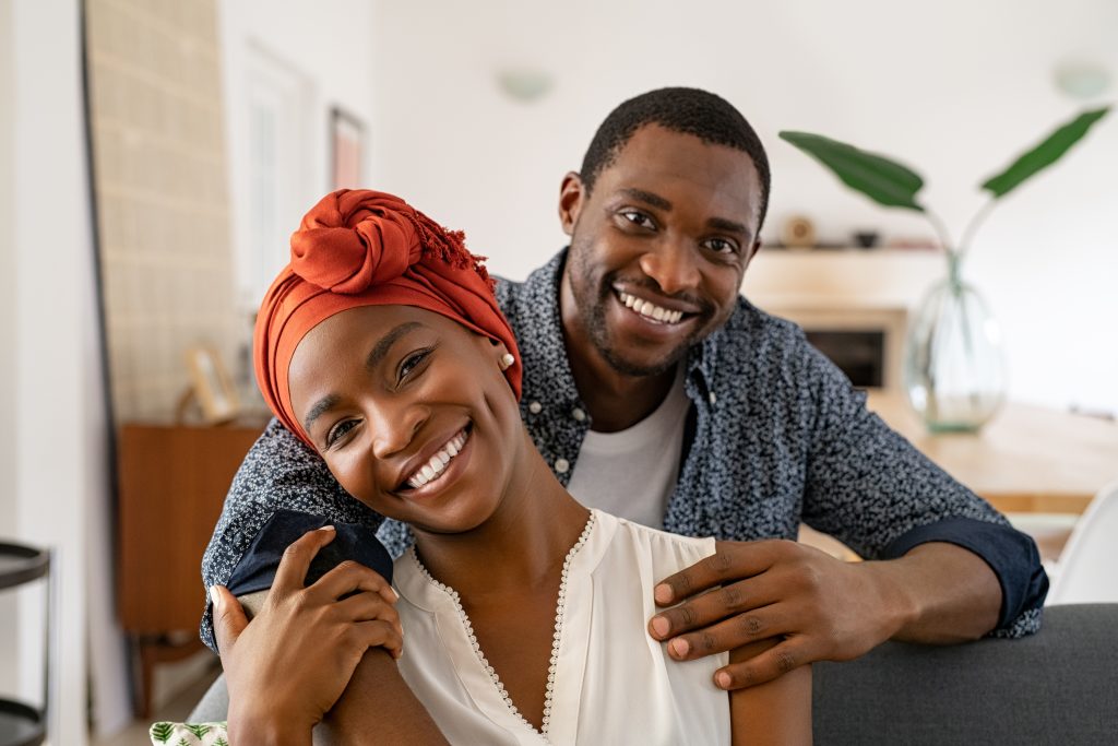 portrait of a couple smiling at a camera